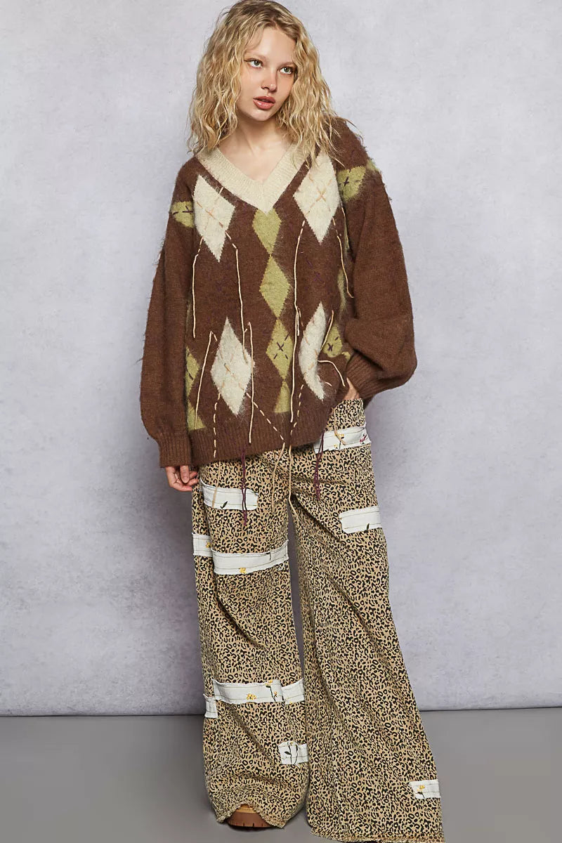 Brown mohair argyle V-neck sweater with long sleeves, diamond pattern, and contrast stitch lines