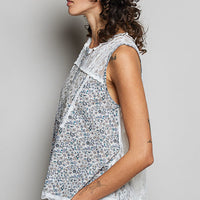 Off-white sleeveless lace back round-neck top with blue floral print panels