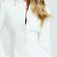 White blazer mini dress close-up showing notched collar and round button placket.
