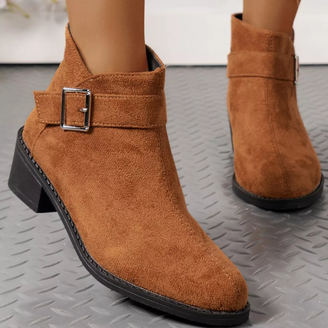 Brown suede point-toe block heel ankle boots with square buckle strap and black sole