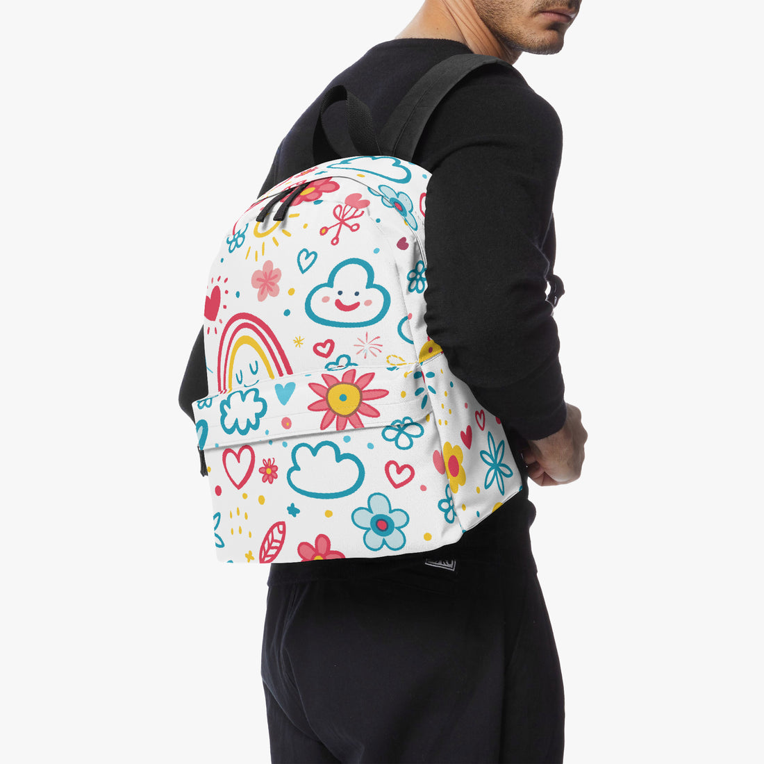 Kids small backpack on person: colorful doodle rainbow print canvas with black side panels