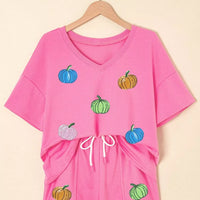 Fuchsia pink V-neck pumpkin print tee and drawstring shorts set on hanger