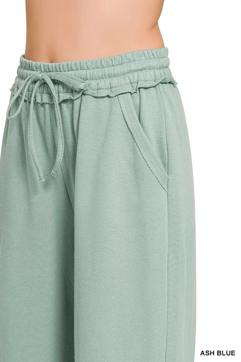 Ash blue wide-leg sweatpants with elastic waistband and adjustable drawstring