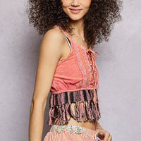 Pink lace-up camisole tank with lace panel and tassel fringe at hem