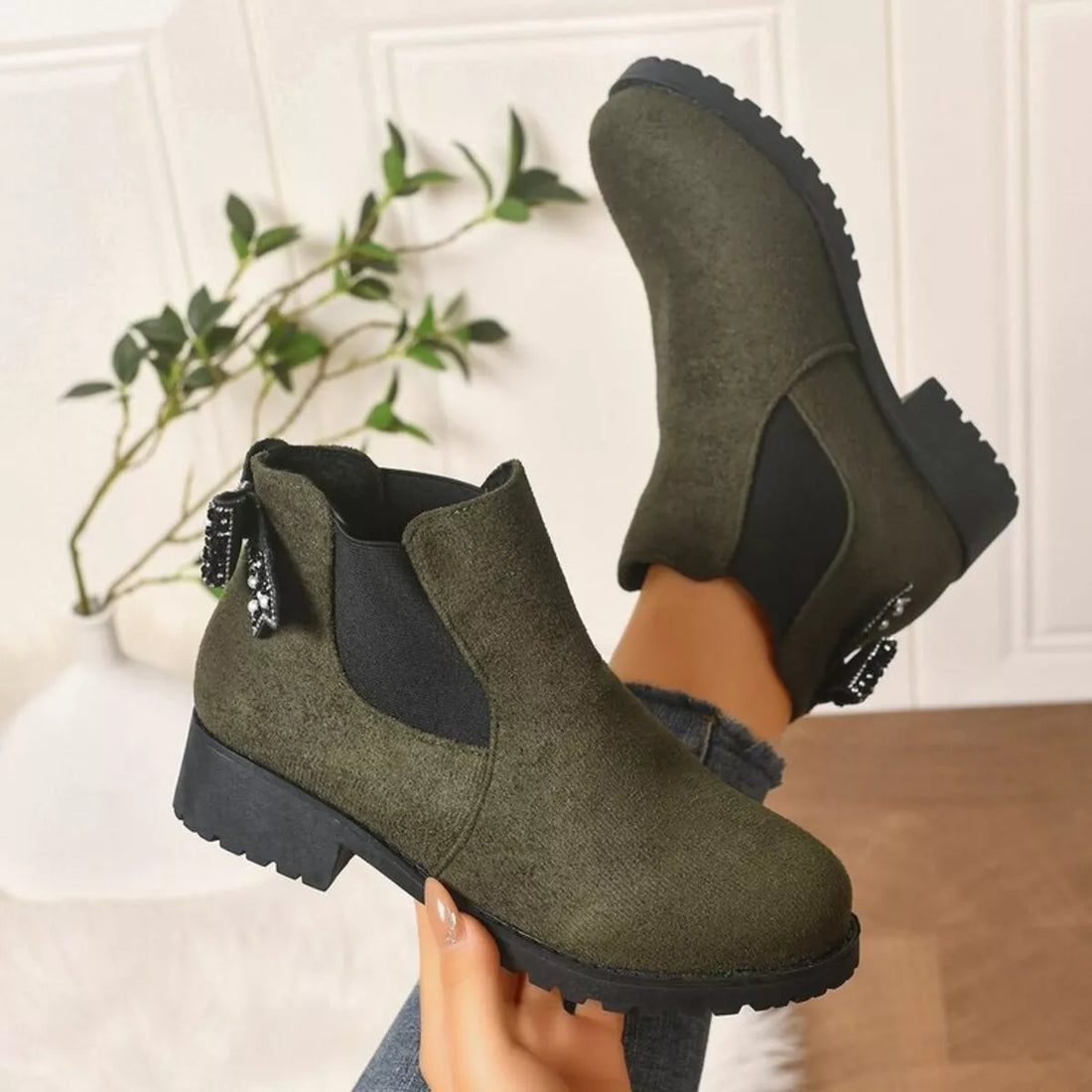 Army green suede ankle boots with round toe, block heel, and jeweled bow collar
