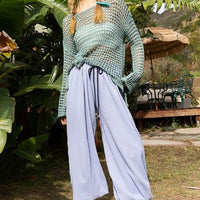 Dusky teal openwork knit cover-up with long sleeves, drawstring waist, side slit hem