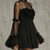 Black sheer mesh mini dress with rosette strapless bodice and layered tulle sleeves