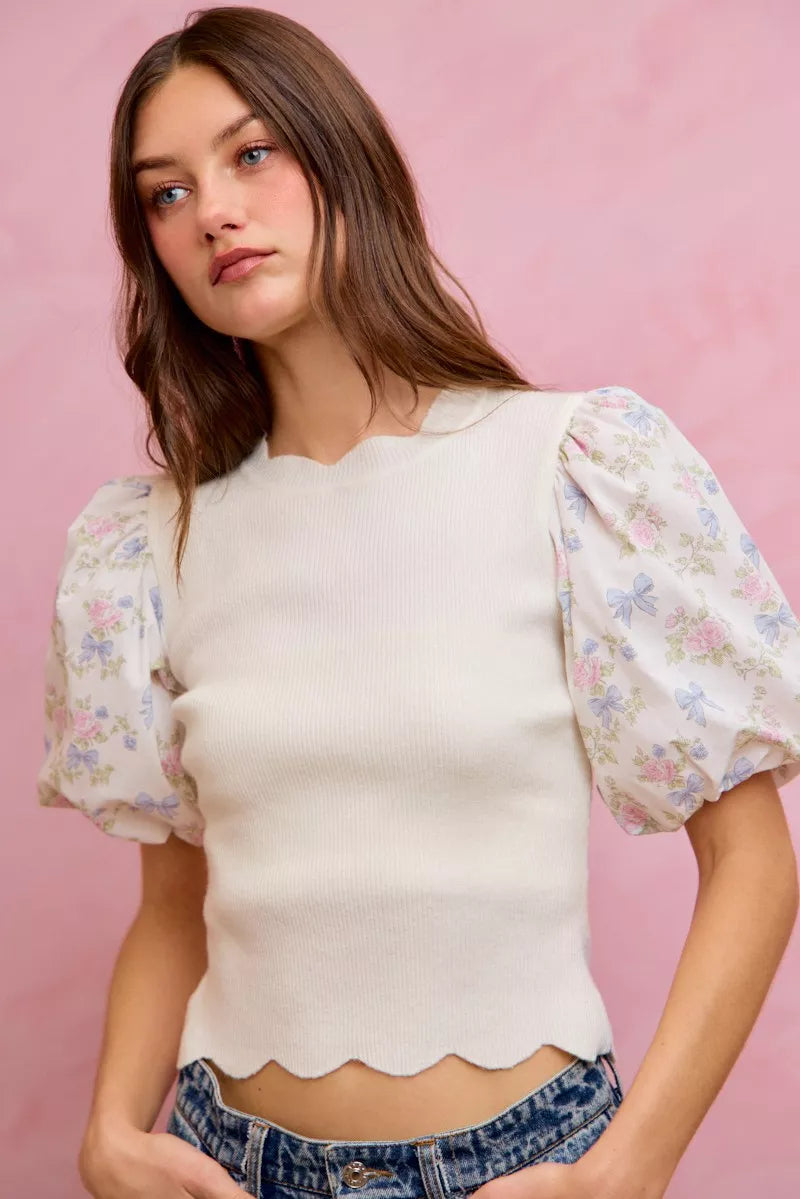 White ribbed sweater top with short puff floral contrast sleeves and scalloped bottom
