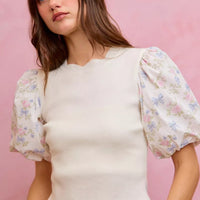 White ribbed sweater top with short puff floral contrast sleeves and scalloped bottom