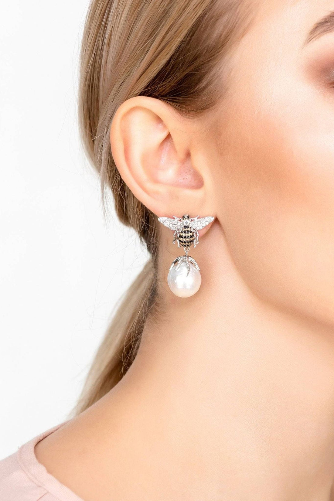 Bee drop earrings with pear-shaped pearl drops, hanging from crystal bee charm