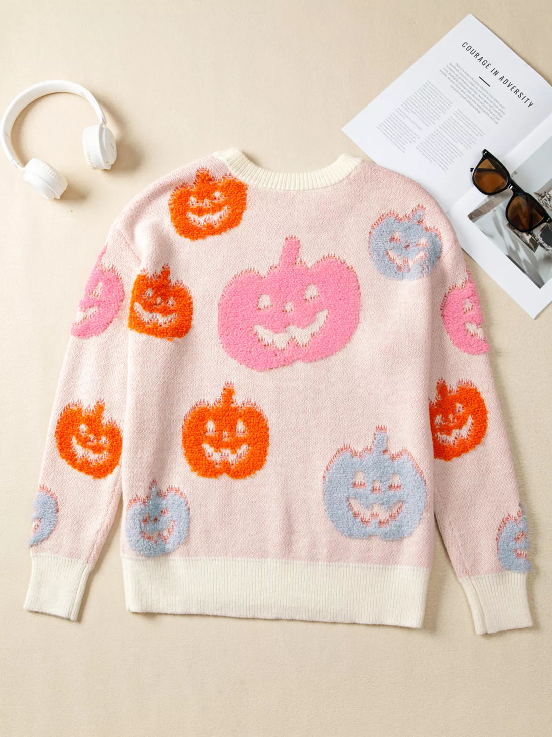 Dusty pink Halloween sweater with fuzzy pumpkin pattern