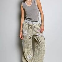 Light grey ribbed V-neck sleeveless tank with contrast trim, full-body model view.