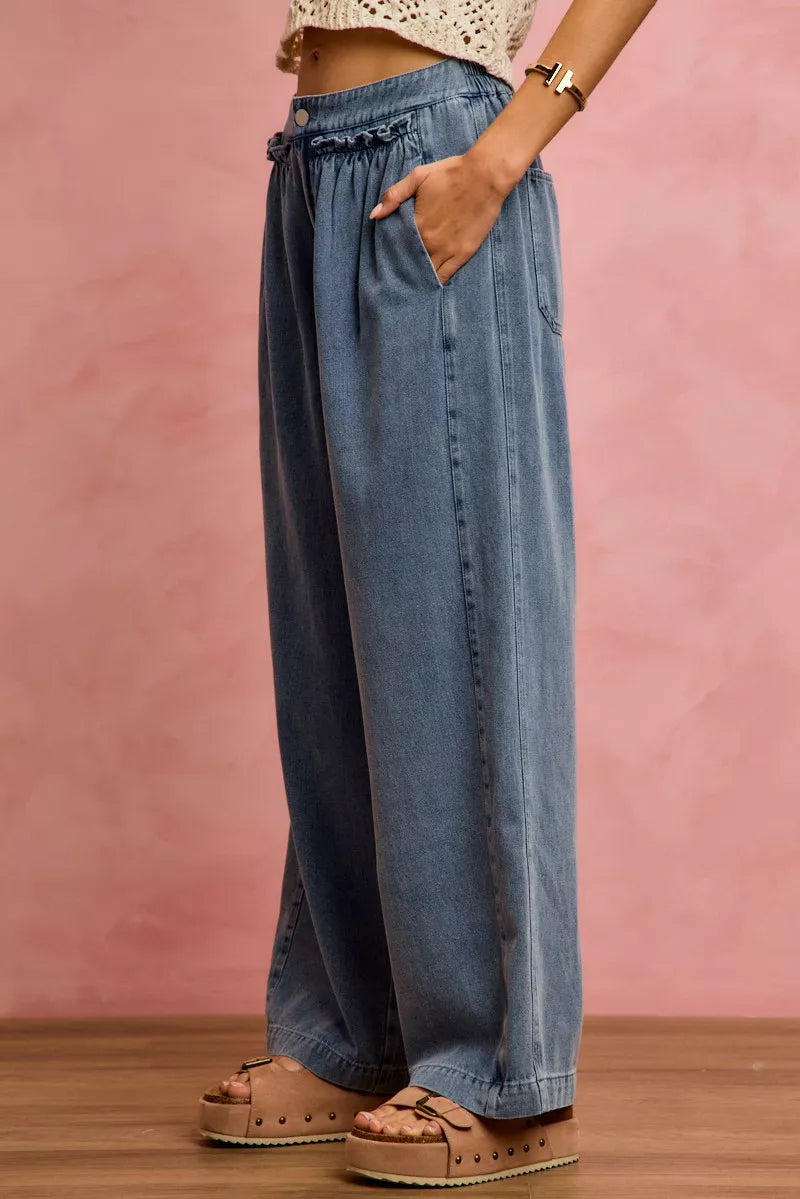 Denim wide-leg jeans with ruffled elastic waistband, side pocket, and straight wide leg