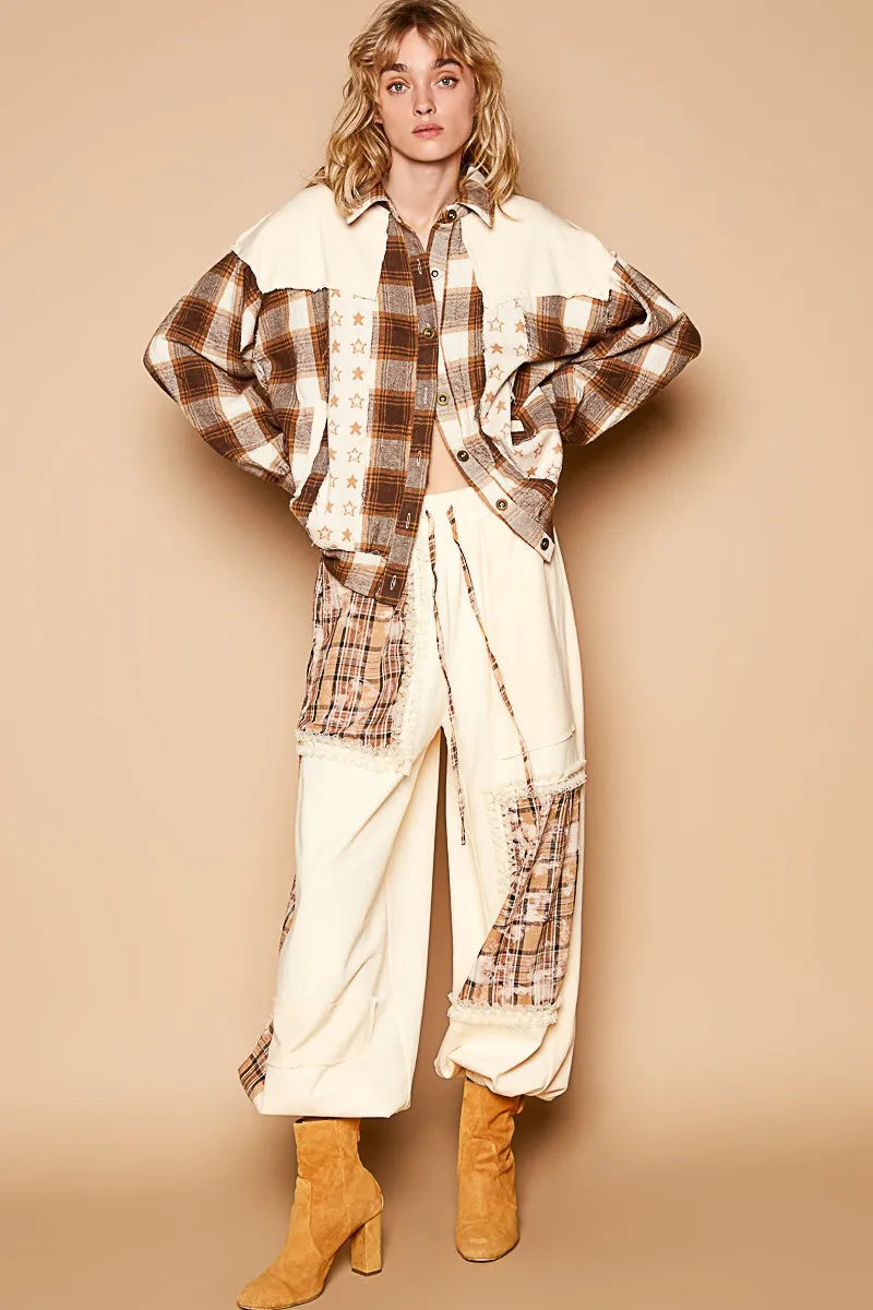 Beige plaid star patchwork shacket worn over light pants and tan boots