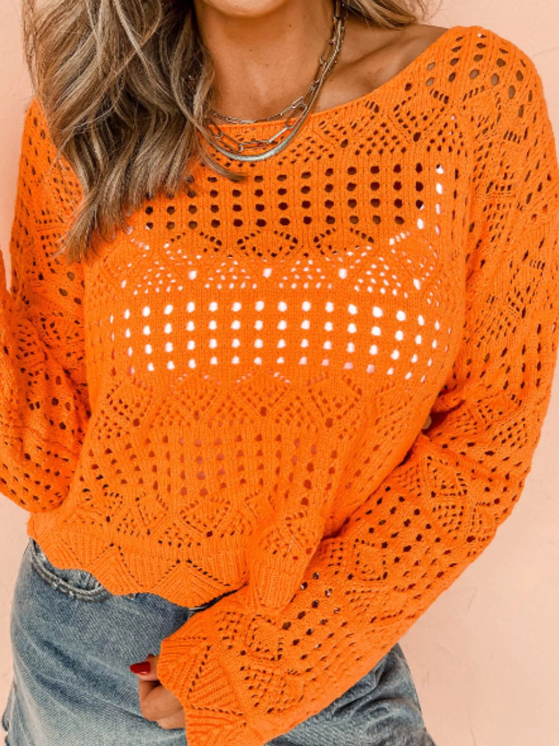 Orange crochet boat-neck knit cover-up with long sleeves and openwork eyelet pattern