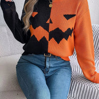 Two-tone pumpkin face graphic sweater, orange/black zip-front knit, long sleeves