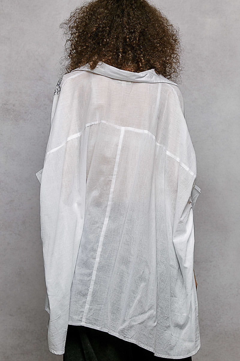 Ivory embroidered floral button-front shirt, back view with high-low hem