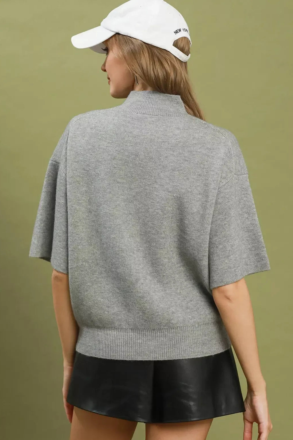 Grey knit sweater top with mock neck and short sleeves, back view
