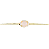 Gold bracelet with oval rose quartz gemstone and pavé halo