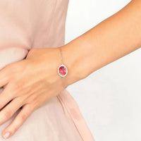 Rose gold pink oval gemstone bracelet worn on wrist