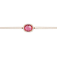 Rose gold bracelet featuring an oval pink gemstone center on a slim chain