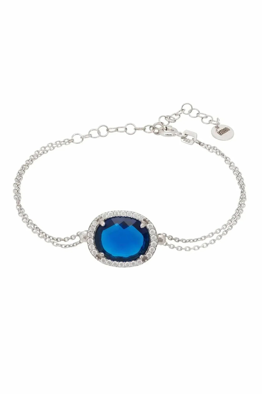 Silver oval gemstone bracelet with blue center stone and halo detail