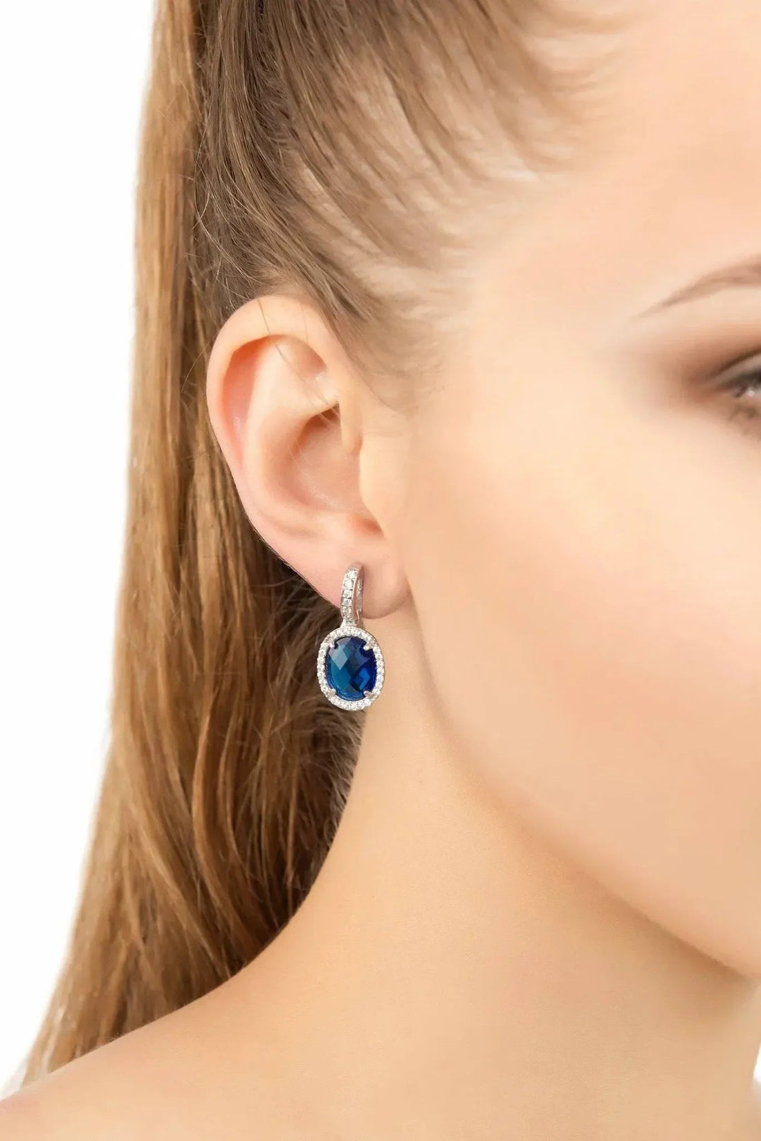 Silver drop earrings with blue oval gemstone and crystal halo