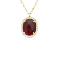 Gold oval gemstone pendant necklace with dark red oval garnet and diamond halo