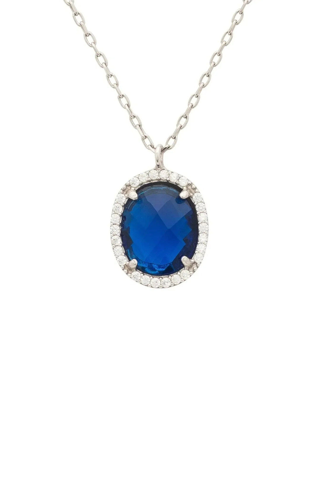 Silver necklace with oval blue gemstone pendant in sparkling halo, cable chain