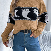 Camel textured sweater with black-and-white ghost motif across front, long sleeves
