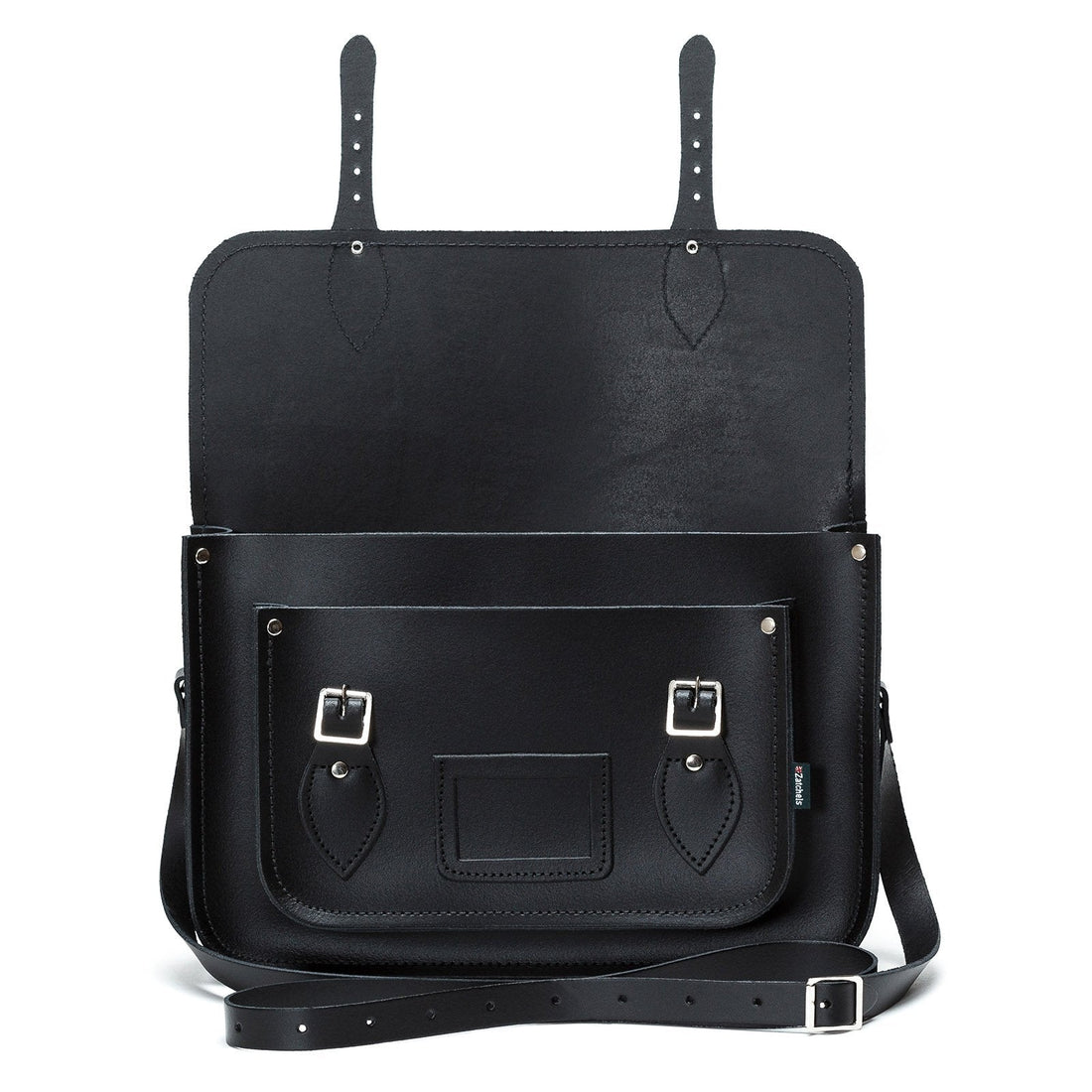 Black leather satchel with two top tabs, front pocket panel, and crossbody strap.