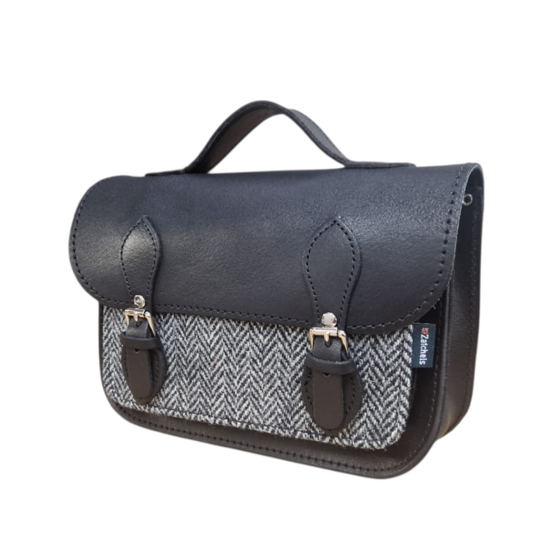 Black leather and tweed midi satchel side view with front clasp and strap
