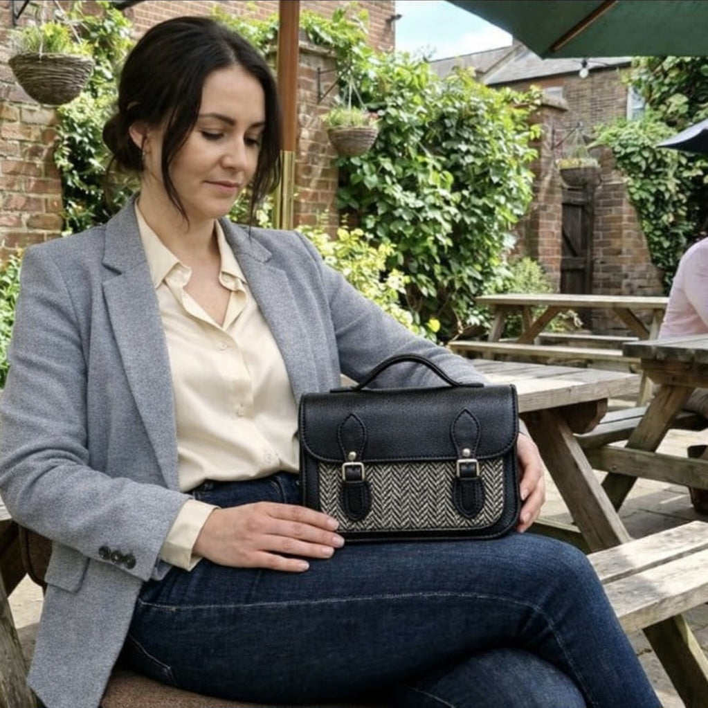 Black leather and tweed midi satchel with flap closure and top handle