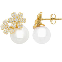 Gold-tone crystal flower stud earrings with pearl center, side view of posts