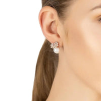 Rosegold floral stud earrings with pearl drop and clear stones