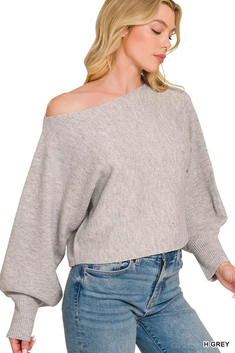Grey knit boat-neck sweater with loose off-shoulder fit and balloon cuffs