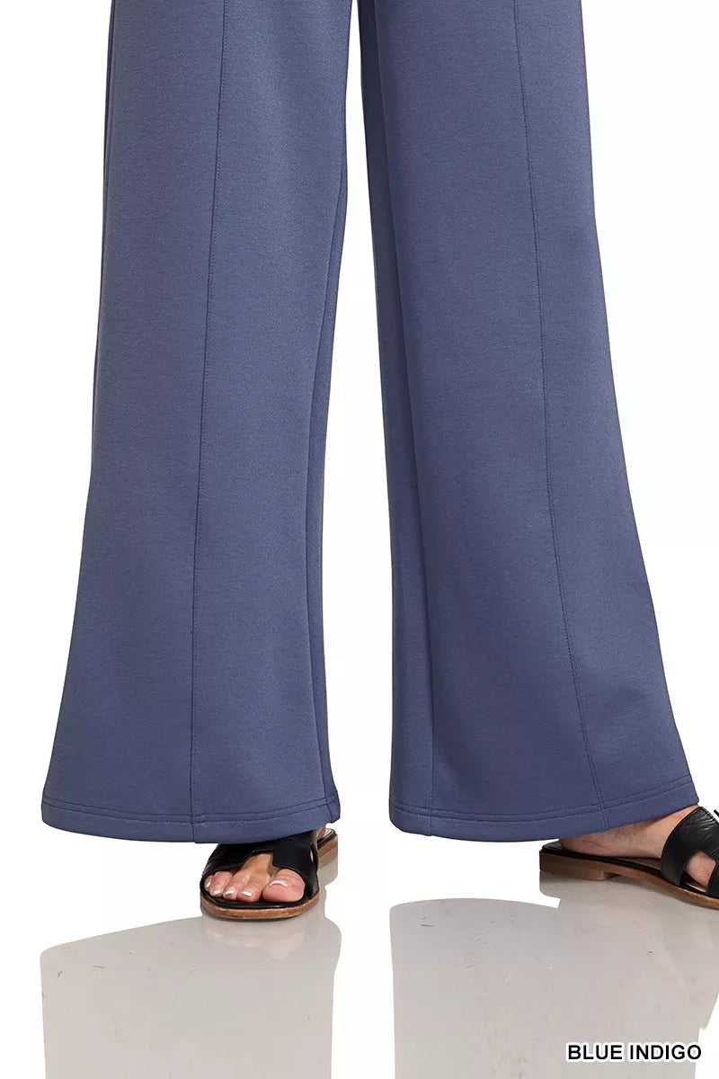 Blue indigo wide-leg center-seam pants with elastic waist, worn with sandals