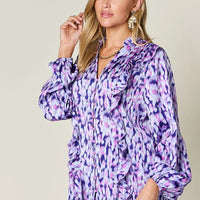Purple printed button-front shirt with ruffle-trim V neckline and balloon sleeves