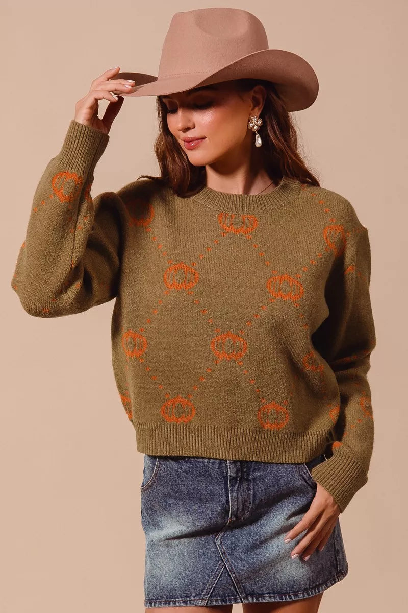 Olive crewneck sweater with orange pumpkin rhombus motif, ribbed cuffs
