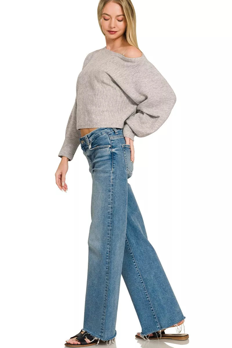 Grey knit boat-neck sweater with long balloon sleeves and relaxed fit