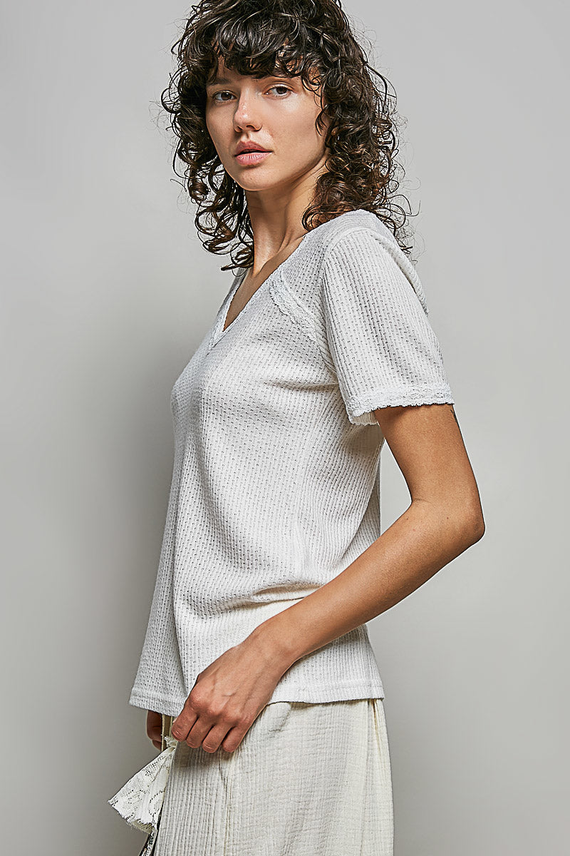 Off-white textured V-neck short-sleeve t-shirt, side profile