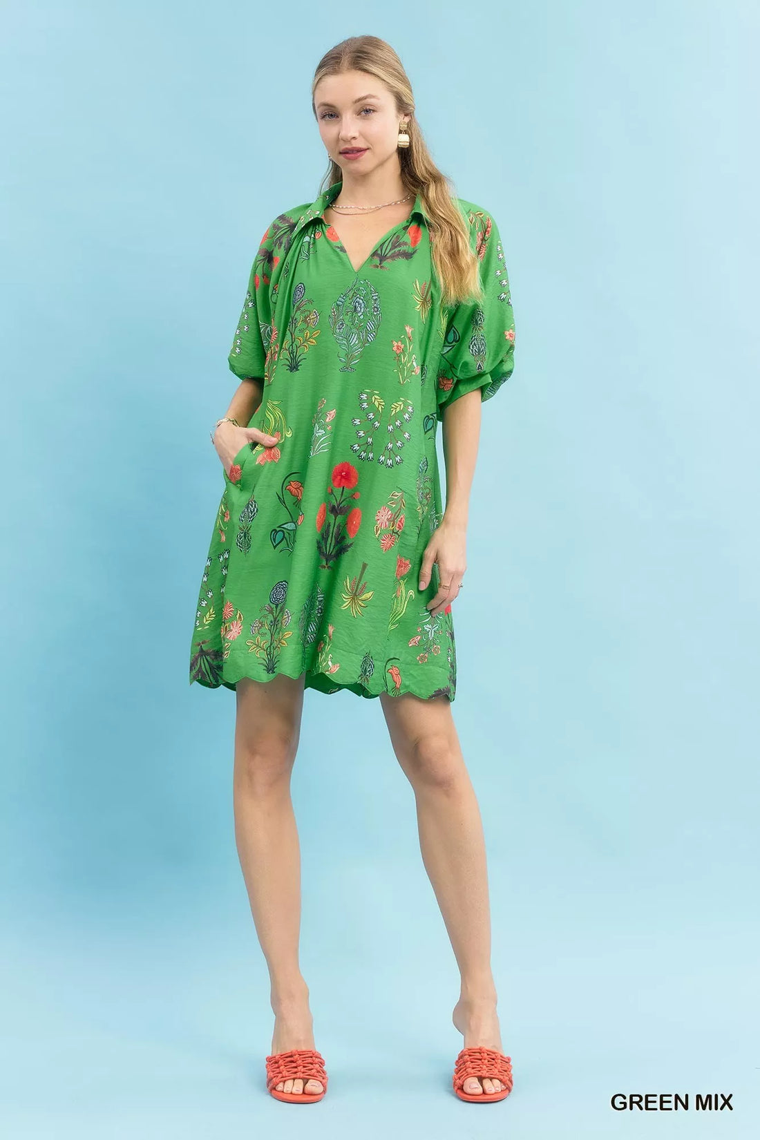 Green floral mini dress with V-neck and short puff sleeves, full front view