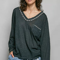 Dark green lightweight knit V-neck long sleeve top with contrast trim, front view