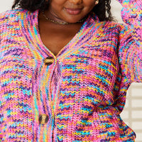 Multicolor knit cardigan close-up, V-neck with gold-tone buttons and textured fabric
