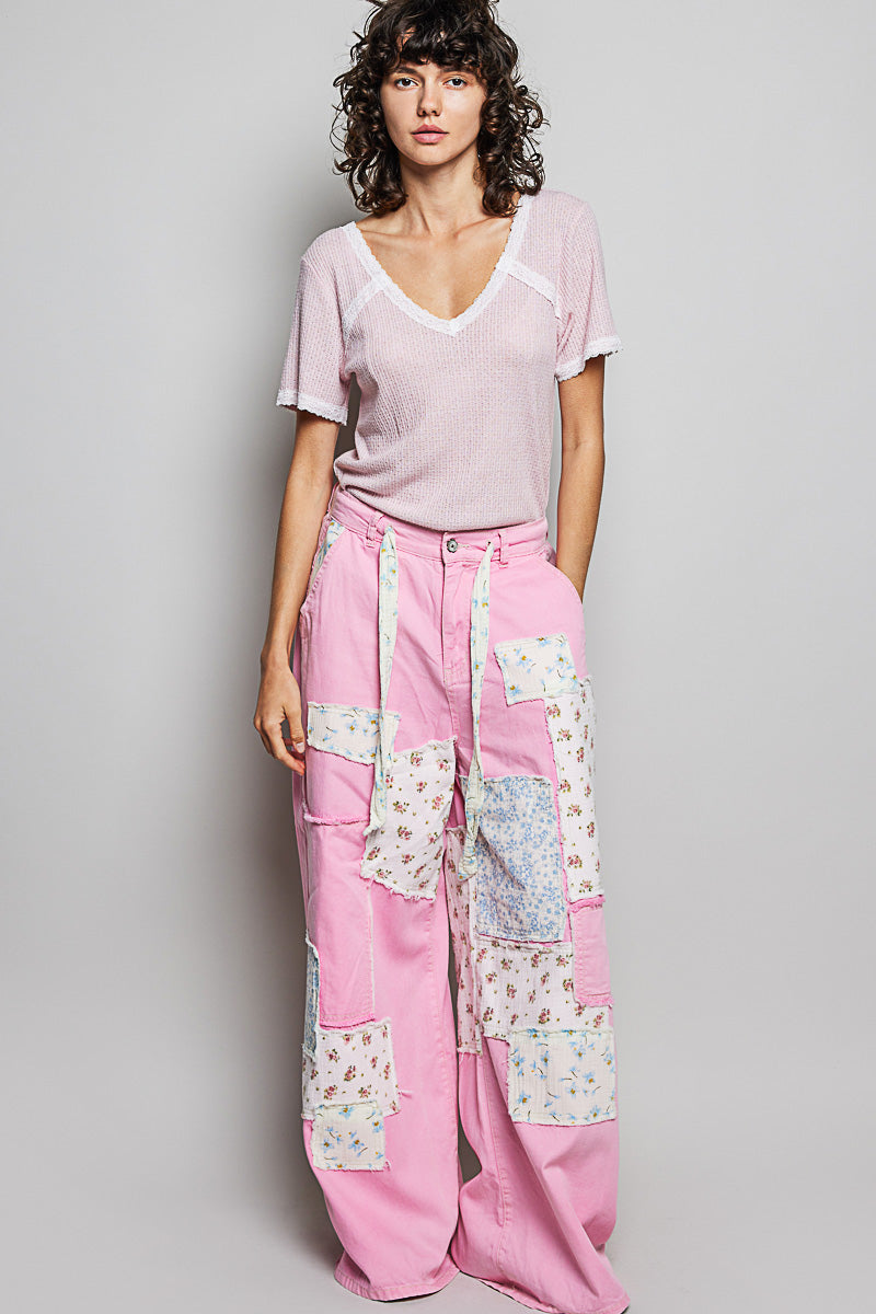 Baby pink textured V-neck T-shirt with white lace-trimmed neckline and short sleeves