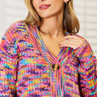 Multicolor v-neck cardigan close-up showing button placket and textured knit