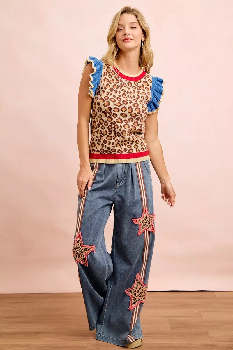 Leopard print knit top with blue ruffled cap sleeves and red neckline and hem trim