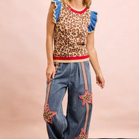 Leopard print knit top with blue ruffled cap sleeves and red neckline and hem trim