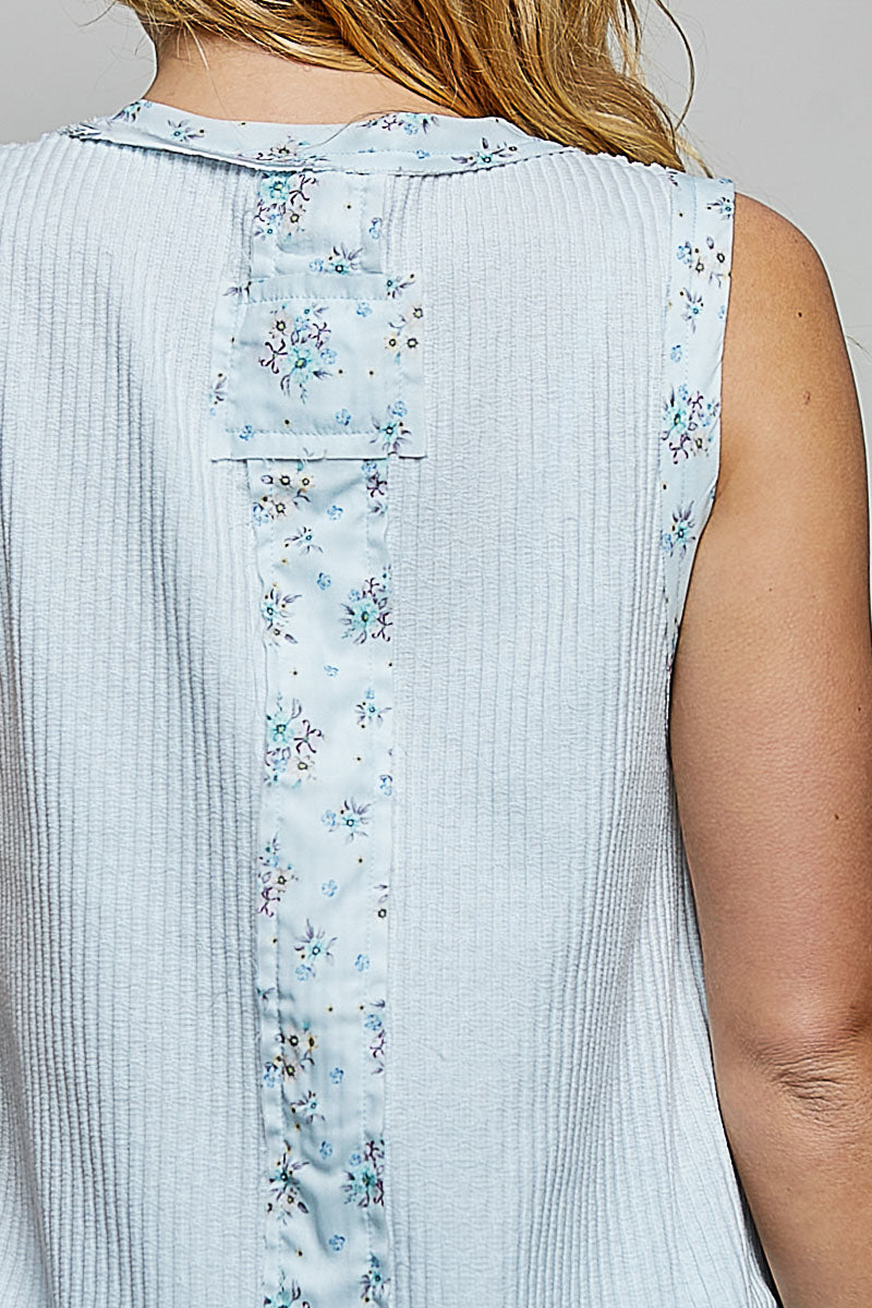 Powder blue back panel of floral print ribbed tank with vertical stitched design