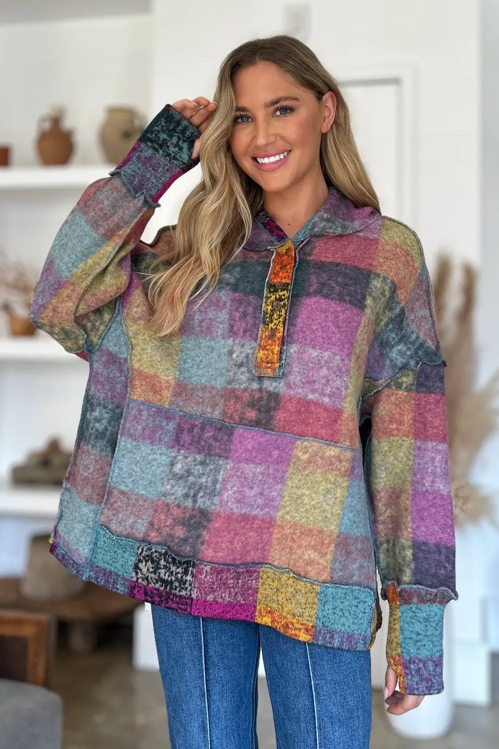 Multicolor plaid fleece hoodie with hood, quarter-zip placket, and dropped shoulders